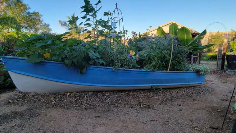 Reviving a Wooden Boat: A Unique Garden Landscaping Idea