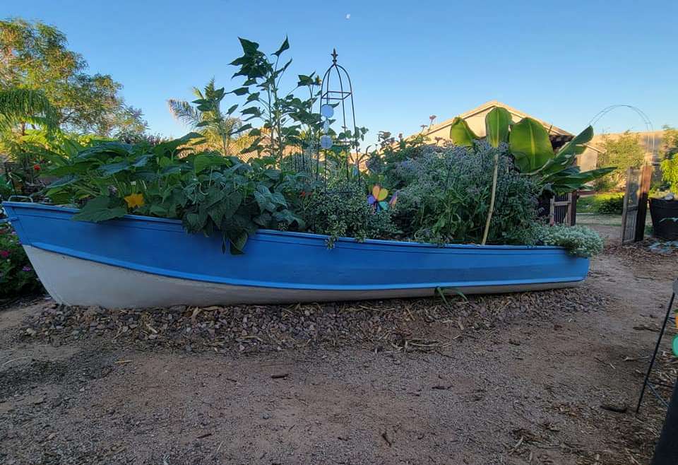 Reviving a Wooden Boat: A Unique Garden Landscaping Idea